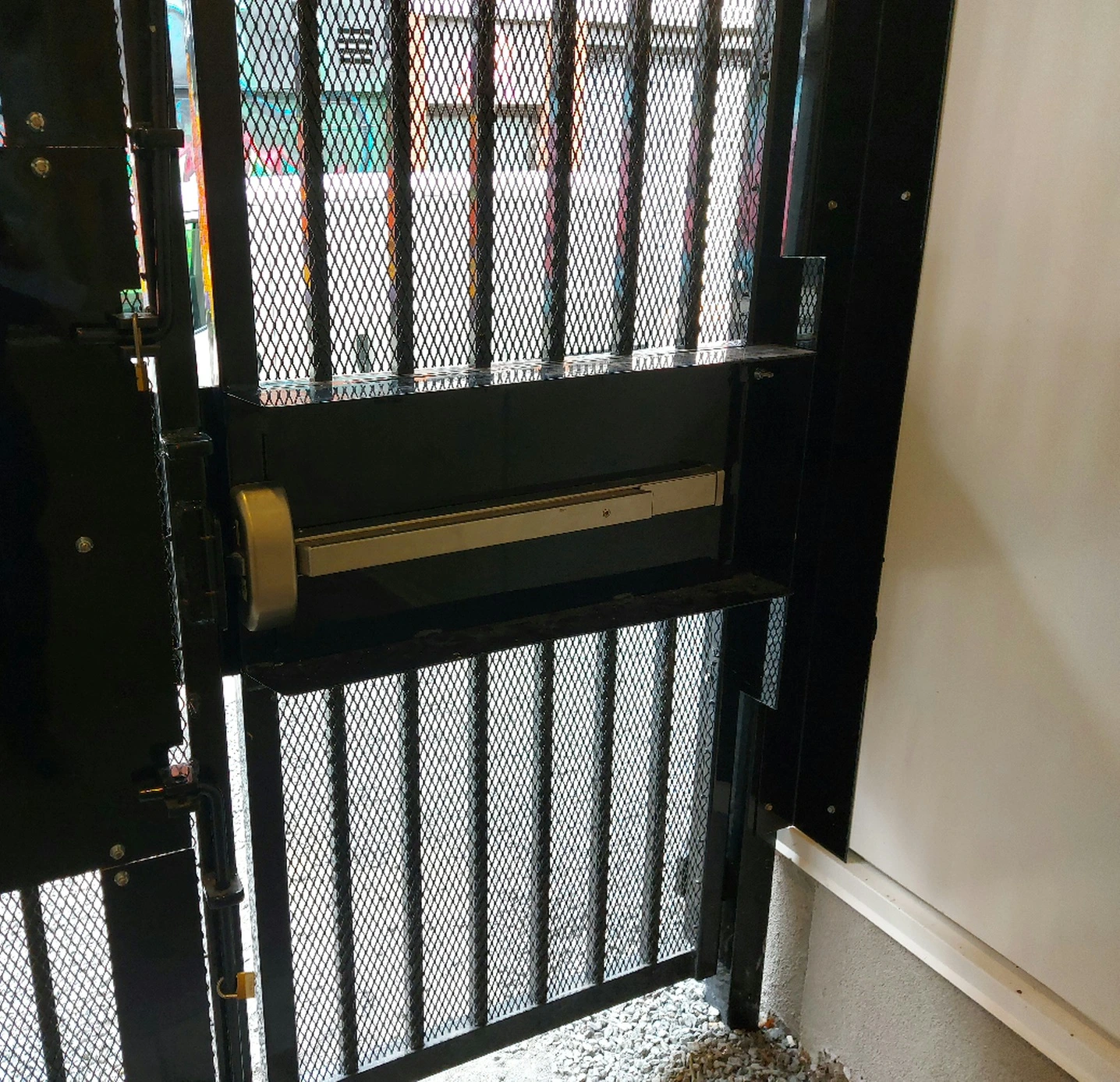 Exit device installation on a grill door