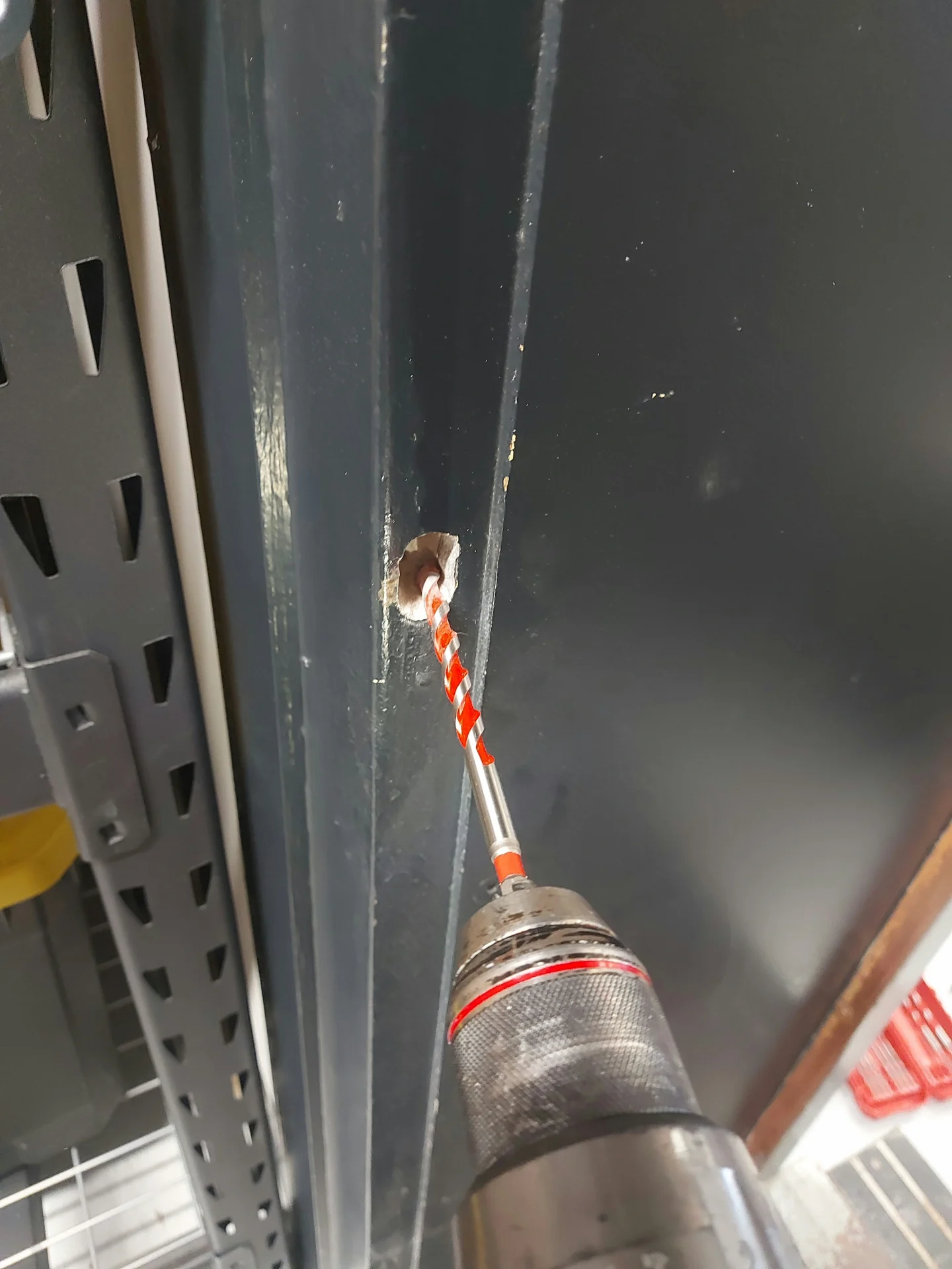 Adjusting a heavy steel frame set in concrete